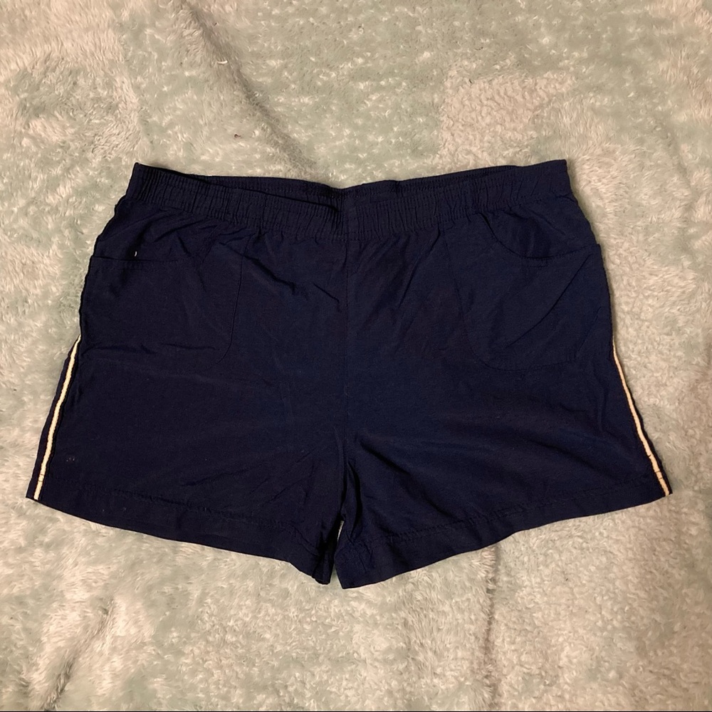 Blue w/ Whites stripes on sides running shorts.